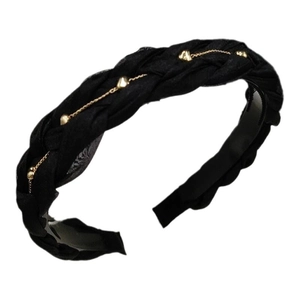 Elegant black woven headband with gold heart chain detail and non-slip teeth for women