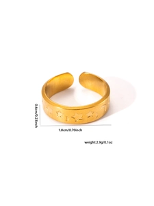 Detail showing 18k gold plated stainless steel ring with embossed stars and moon patterns