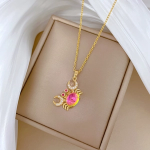 Golden crab necklace with pink crystal and zircon on elegant silk and jewelry box