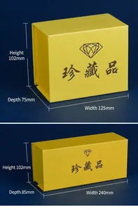 Two sizes of yellow vintage gift boxes with black diamond logo on blue velvet