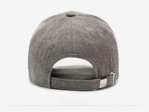 Detail view of the gray herringbone fabric baseball cap with adjustable silver metal buckle