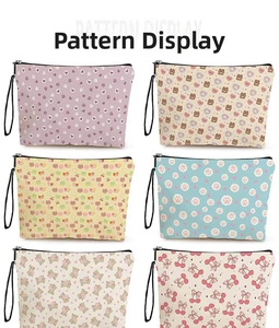 Collection of various cartoon bear and floral patterns on portable toiletry bags
