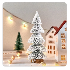 Macro detail of snow-flocked mini Christmas tree with natural wood base and festive lights