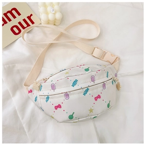 Detail view of cream canvas kids waist bag with colorful candy and ice cream prints
