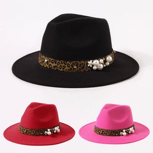 Detailed view of felt cowboy hats in black, red and pink with leopard bands and pearls