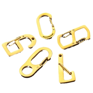 Polished golden stainless steel lobster clasps in five geometric shapes for DIY jewelry