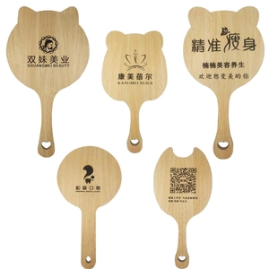 Detailed close-up of custom wooden hand mirrors in various shapes like cat and bear ears