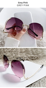Detailed view of rimless gradient grey-pink ocean sunglasses with slim gold metal temples