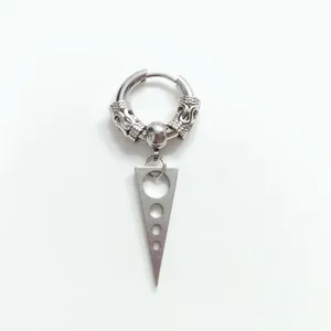 Detail of silver punk earring featuring textured ring and triple-hole triangle pendant