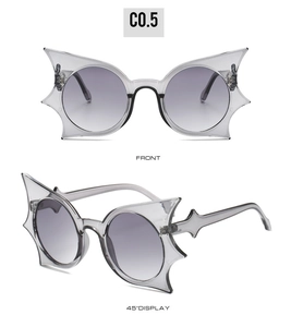 Front and side view of bat-wing shaped sunglasses with grey gradient lenses