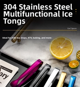 Close-up of colorful 304 stainless steel mini ice tongs and sugar clips on marble table