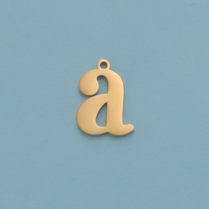 Close-up of a gold stainless steel lowercase letter a pendant on a blue background