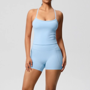 Detail of sky blue high-waisted yoga shorts with functional side pockets for gym fitness