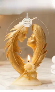 Macro detail of silicone mold showing heart wings and couple relief design for DIY candles