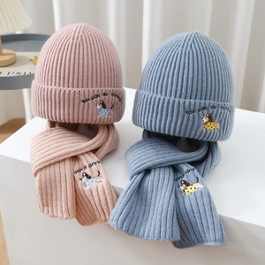 Kids knitted hat and scarf set with cute dog embroidery for winter warmth in blue and pink