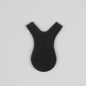 Close-up of black Y-shaped lash lifting tool with fine comb teeth and anti-slip handle