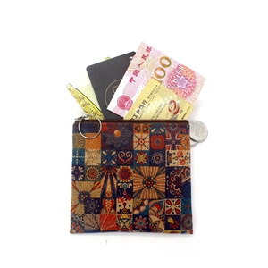 Geometric patchwork cork print coin purse with a square zipper and metal keyring
