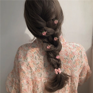 Pink peach and bow hair clip set shown on brunette braided hair for a sweet girls look