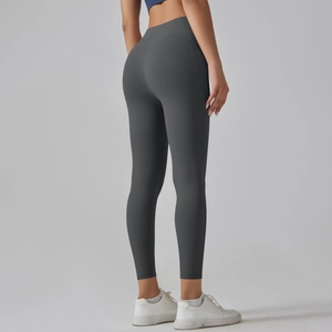 Rear view of high waisted dark grey yoga pants showing lifting effect and tight fit