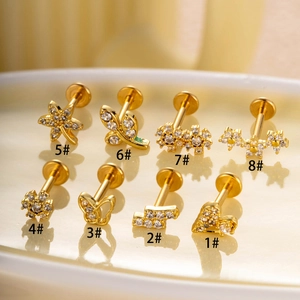 Eight unique gold-plated stainless steel labret studs with various shapes and zircon stones