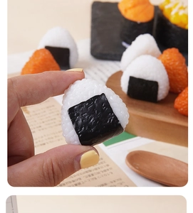 Macro view of realistic handmade resin triangle sushi onigiri model with rice texture