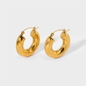Detailed close-up showing the 18k gold plated spiral twist texture of the hoop earrings