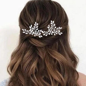 Elegant bridal hair pins set with silver leaf wire and sparkling crystal rhinestones