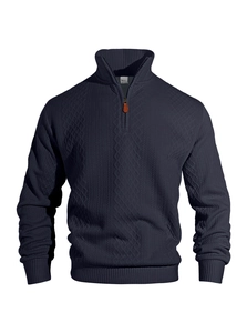 Close-up of navy blue men's quarter-zip sweatshirt with intricate jacquard knit texture