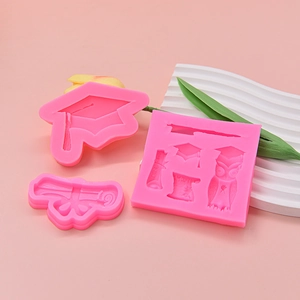 Pink graduation silicone mold set featuring mortarboard owl and scroll for cake decor