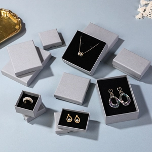 Gray textured jewelry box set with black velvet lining for rings and necklaces