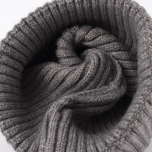 Thick charcoal grey knit beanie for women featuring a warm ribbed texture and soft fabric