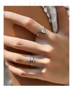 Close-up of s925 silver irregular rings with pear and oval-cut sparkling zircon stones