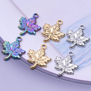 Polished stainless steel maple leaf charms in gold, silver, and rainbow finishes for DIY