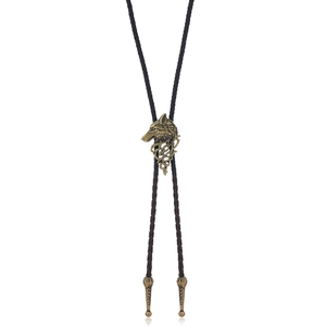 Detailed wolf head relief on bronze bolo tie with braided leather cord on white background
