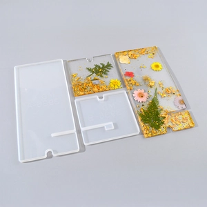 Detail view of rectangular silicone resin molds for DIY phone stands with floral inserts