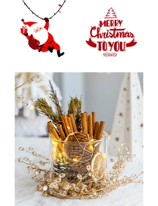 Festive Christmas decor with pine cones, cinnamon, and LED lights in glass jar