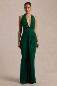 Detail view of the deep green halter neck dress with pleated waist and elegant long sash