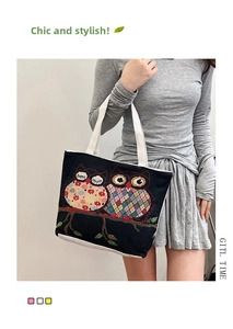 Close-up of owl embroidery on ethnic canvas tote bag with floral patchwork details