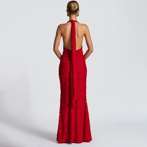Detailed back view of a red lace halter evening dress featuring an open back with long ties