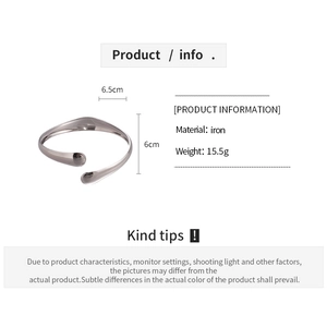 Detailed view of silver minimalist wavy iron cuff bracelet weighing 15.5g with dimensions