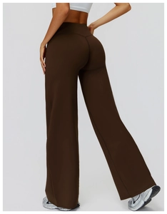 Detail view of the high waist and contoured fit on dark brown fleece wide-leg yoga pants