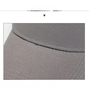 Detailed view of gray baseball cap featuring reinforced stitching on the brim
