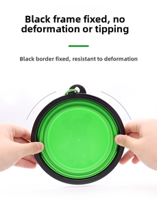 Detail showing the thin foldable profile of a green silicone dog bowl with a black frame