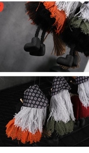 Close-up of Halloween gnome decorations featuring tulle skirts and floral pointed hats