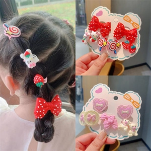 Detail of sweet princess hair clips with mesh bows and cute cartoon resin charms