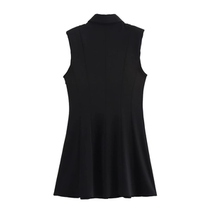 Detailed back view of a black sleeveless commuter dress with shoulder pads and a pleated hem