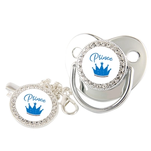 Detail of silver baby pacifier and clip with crown prince design and inlaid rhinestones