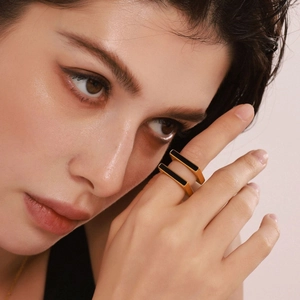 Minimalist square acrylic rings in 18K gold plated stainless steel, stacked on finger