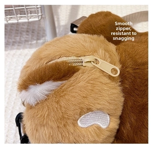 Close-up of smooth metal zipper on cute capybara plush backpack with brown faux fur