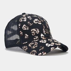 Close-up of leopard print trucker hat with breathable black mesh and ponytail hole